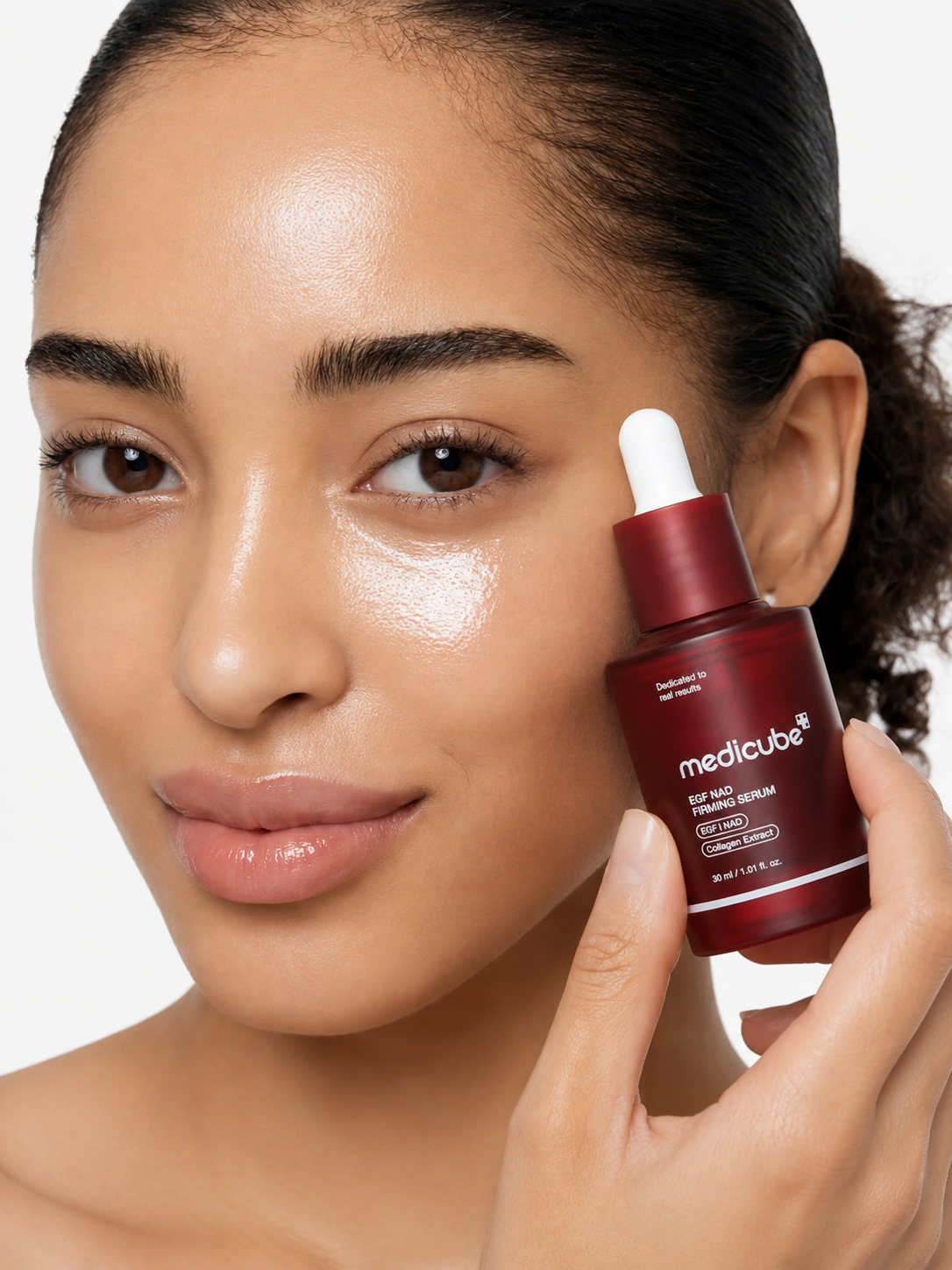 Woman holding Aeterna EGF NAD Firming Serum